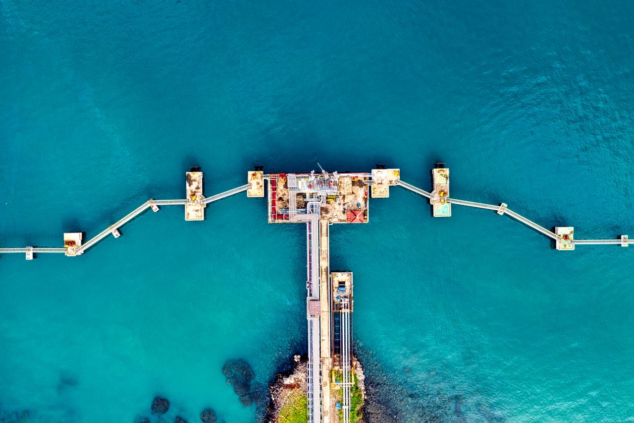 services-01 Aerial photograph of a uniquely structured pier extending into the sea in Banten, Indonesia.